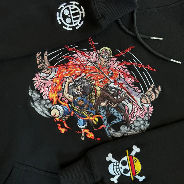 Dressrosa Showdown: Doflamingo vs. Luffy and Law Embroidered Hoodie.